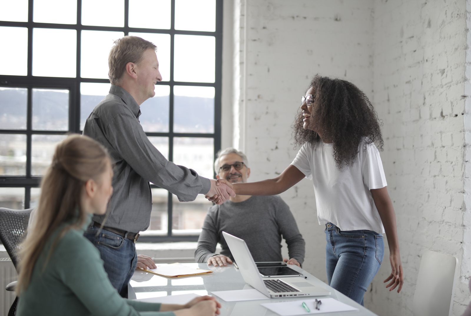 African and global professionals collaborating around a product discussion